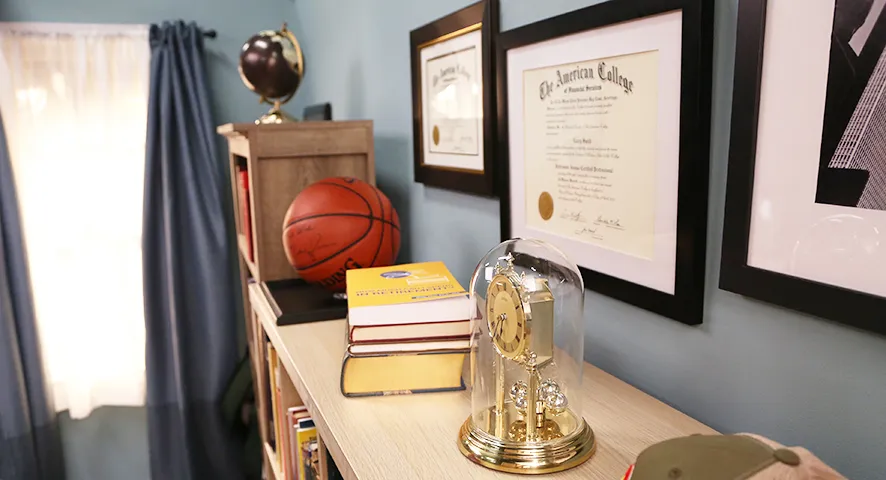Book shelf with trophies and awards