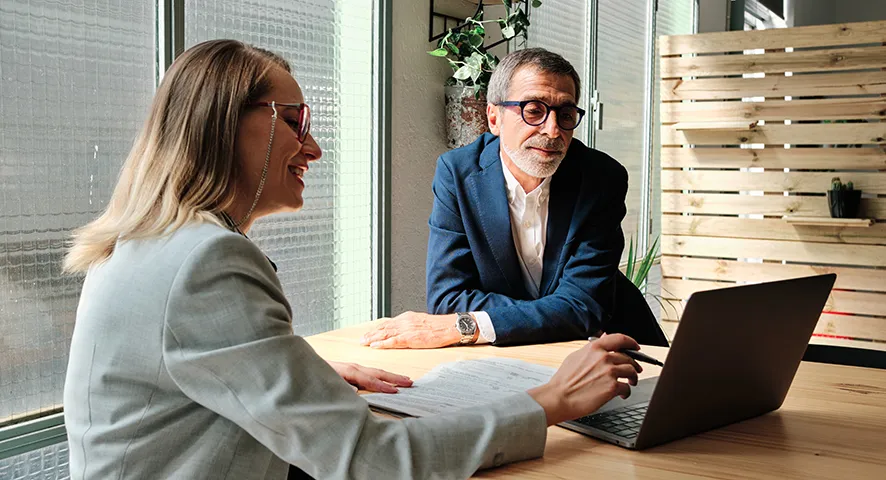 Advisor showing client information on her computer screen