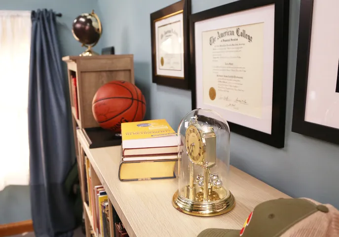 Book shelf with trophies and awards